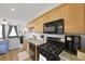Well-equipped kitchen with stainless steel appliances, granite countertops, and views to a comfortable seating area at 330 Ripple Park Dr, Summerville, SC 29486