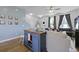 Cozy living room with comfortable sofas, stylish furnishings, and a blue accent wall that creates a welcoming atmosphere at 330 Ripple Park Dr, Summerville, SC 29486