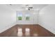 Inviting bedroom with hardwood floors, natural light, and ceiling fan for added comfort at 3927 Four Poles Park Dr, North Charleston, SC 29405