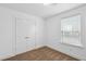 A bedroom has carpeted floors, a window with blinds, and a double-door closet at 3927 Four Poles Park Dr, North Charleston, SC 29405