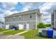 Exterior of a row of townhomes with a lawn and parking at 3927 Four Poles Park Dr, North Charleston, SC 29405