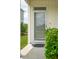 Inviting front door with a clear view and security features, framed by lush greenery at 3927 Four Poles Park Dr, North Charleston, SC 29405