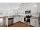 Modern kitchen features stainless steel appliances, granite countertops, and white cabinetry at 3927 Four Poles Park Dr, North Charleston, SC 29405