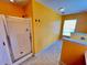 Bathroom featuring a glass shower enclosure, tile floors, and a bright window at 412 Beverly Dr, Summerville, SC 29485