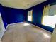 Bedroom with blue walls, neutral carpet, and two sunny windows at 412 Beverly Dr, Summerville, SC 29485