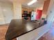 Kitchen with countertop island featuring a sink, along with wood cabinets at 412 Beverly Dr, Summerville, SC 29485