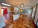 Open-concept living area with hardwood floors, modern lighting, and an island at 412 Beverly Dr, Summerville, SC 29485