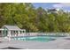 Outdoor community pool with umbrellas and lounge chairs for relaxing provides a resort-style living experience at 412 Beverly Dr, Summerville, SC 29485