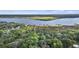 Aerial view of waterfront neighborhood with green trees and boats docked at 4601 Apple St, North Charleston, SC 29405