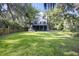 Well-maintained lawn features a multi-level home with an expansive backyard, ready for play at 4601 Apple St, North Charleston, SC 29405