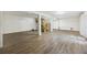 Spacious unfinished basement with wood flooring and wooden staircase at 4601 Apple St, North Charleston, SC 29405