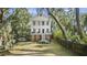 Charming two-story home with a spacious yard and beautiful mature trees at 4601 Apple St, North Charleston, SC 29405