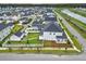 Aerial view of a residential neighborhood showcasing single-Gathering homes and a serene lake at 501 Rhythm St, Summerville, SC 29486