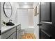 Stylish bathroom with a vanity, framed mirrors, and coordinated tile and flooring at 501 Rhythm St, Summerville, SC 29486