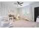 Bright Bedroom features playful wallpaper, modern ceiling fan, and ample natural light at 501 Rhythm St, Summerville, SC 29486
