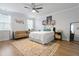 Spacious bedroom with a ceiling fan, textured rug, sofa, and bright natural light at 501 Rhythm St, Summerville, SC 29486