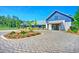 Beautiful community clubhouse with brick paved entryway and lush landscaping at 501 Rhythm St, Summerville, SC 29486