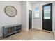 Inviting entryway featuring stylish decor, a wooden cabinet, and modern flooring at 501 Rhythm St, Summerville, SC 29486