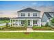 Charming two-story home featuring a spacious front porch and beautifully landscaped front yard at 501 Rhythm St, Summerville, SC 29486