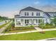 Charming two-story home featuring a spacious front porch and beautifully landscaped front yard at 501 Rhythm St, Summerville, SC 29486