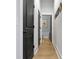 Hallway with three black doors leading to bath; decorated with modern art at 501 Rhythm St, Summerville, SC 29486
