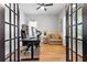 Stylish home office with hardwood floors, french doors, neutral colors, and a comfortable chair at 501 Rhythm St, Summerville, SC 29486