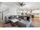 Spacious living room with a large sectional sofa, modern ceiling fan, and open floor plan at 501 Rhythm St, Summerville, SC 29486