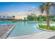 Stunning zero-entry pool with palm trees and lounge chairs, perfect for relaxing and enjoying the outdoors at 501 Rhythm St, Summerville, SC 29486