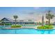 Community pool with a view of the clubhouse and lush landscaping, perfect for relaxation at 501 Rhythm St, Summerville, SC 29486