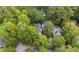 An aerial view of a lush, tree-covered neighborhood, showcasing the property's serene setting and proximity to nature at 5152 Coral Reef Dr, Johns Island, SC 29455