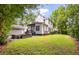 Expansive backyard featuring a well-maintained lawn, a covered patio, and an outdoor seating area perfect for entertaining at 5152 Coral Reef Dr, Johns Island, SC 29455