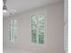 Bedroom with a ceiling fan and shuttered windows at 5152 Coral Reef Dr, Johns Island, SC 29455
