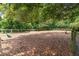 Community dog park surrounded by green trees with fenced perimeter and benches at 5152 Coral Reef Dr, Johns Island, SC 29455