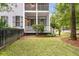 Charming two-story home with double porches, black fence, and manicured lawn at 5152 Coral Reef Dr, Johns Island, SC 29455
