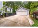 Detached two-car garage with a concrete driveway, providing ample parking and storage space at 5152 Coral Reef Dr, Johns Island, SC 29455