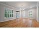 Spacious living room with natural light from multiple windows and French doors at 5152 Coral Reef Dr, Johns Island, SC 29455