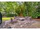 Cozy outdoor patio with brick pavers and wicker furniture, offering a serene spot for relaxation and gatherings at 5152 Coral Reef Dr, Johns Island, SC 29455
