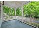 Charming porch with blue flooring and white railings, perfect for relaxing at 5152 Coral Reef Dr, Johns Island, SC 29455