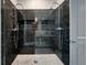 Black marble walk-in shower with a glass partition at 5152 Coral Reef Dr, Johns Island, SC 29455