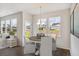 Cozy dining area with a round table, chandelier, and an abundance of natural light at 545 Verdi Drive Dr, Summerville, SC 29486