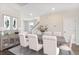 Formal dining room with elegant decor, statement artwork, and seating for six at 545 Verdi Drive Dr, Summerville, SC 29486