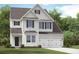 Charming two-story home with a manicured lawn and attached two car garage at 545 Verdi Drive Dr, Summerville, SC 29486