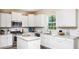 Well-lit kitchen featuring white cabinets, stainless steel appliances, and subway tile backsplash at 547 Verdi Drive Dr, Summerville, SC 29486