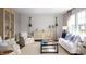Bright living room with a coastal style decor including white furniture and nautical themed accents at 547 Verdi Drive Dr, Summerville, SC 29486