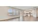 Open living space featuring hardwood floors, large windows, and a view into the kitchen at 547 Verdi Drive Dr, Summerville, SC 29486