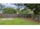Backyard with wooden fence creating a private outdoor space, surrounded by lush trees at 600 Dolphin Dr, Summerville, SC 29485