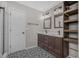 Bright bathroom with double vanity, decorative tile flooring, and walk-in tiled shower at 600 Dolphin Dr, Summerville, SC 29485