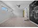 Bright bedroom with neutral carpet, ceiling fan, and unique chalkboard wall feature at 600 Dolphin Dr, Summerville, SC 29485