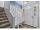 Light-filled entryway with coat rack, bench, and staircase leading to the upper level at 600 Dolphin Dr, Summerville, SC 29485