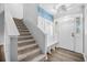 View of foyer and stairs in home featuring coat hooks and built-in bench seating at 600 Dolphin Dr, Summerville, SC 29485